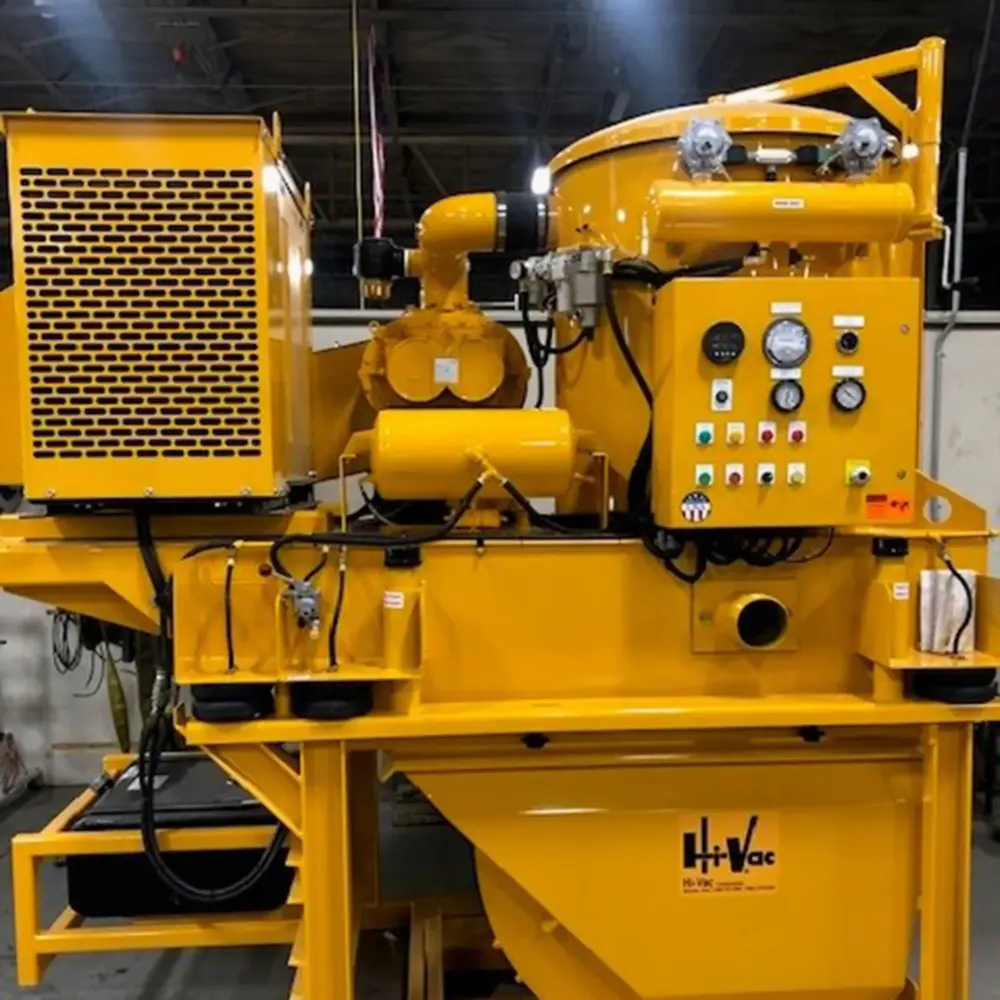 Bright yellow Hi-Vac industrial vacuum unit with control panel, pressure gauges, hoses and large collection hopper.