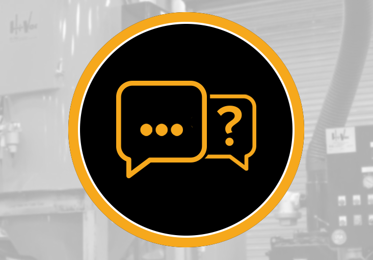 Black circular badge with orange speech-bubble icons over blurred Hi-Vac industrial vacuum equipment and control panel.